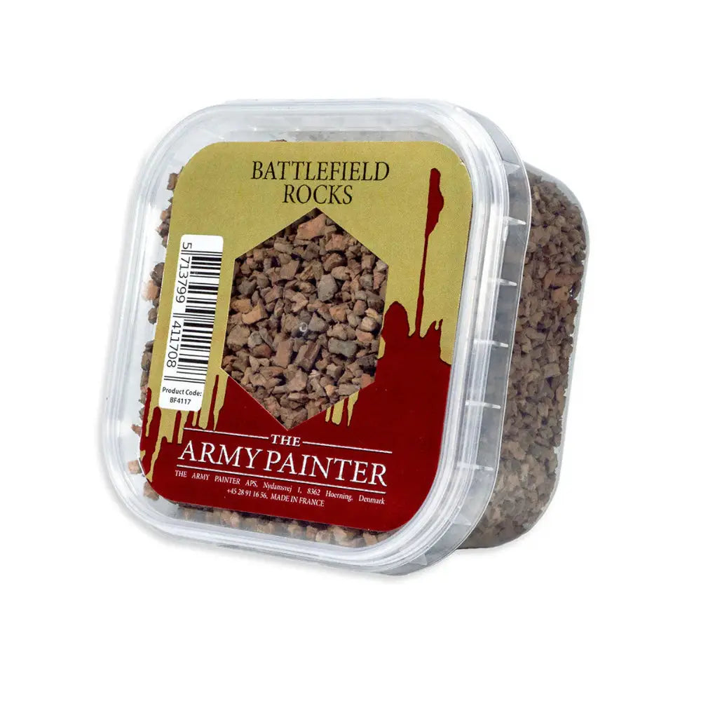Army painter basing battlefield rocks in clear plastic container with brownish gray gravel pieces for terrain modeling