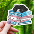 Cat Sleeping on Pride Books Sticker - Black Cat Transgender Books - Gifts