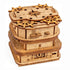 A wooden intricately carved nautical puzzle box featuring ship wheels and compass directions called cluebox 3 davy jones locker