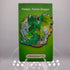 Green enamel elemental dragon pin with leafy wings and body against floral foliage background