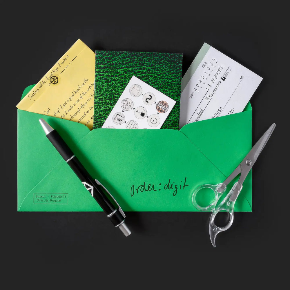 Green envelope labeled order digit with black pen and clear scissors containing papers for family secrets escape game