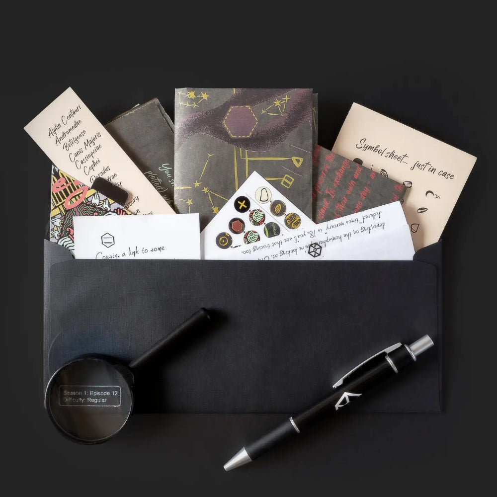 Black leather envelope filled with astrology-themed stationery and accessories for family secrets escape game