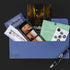 Blue envelope containing travel items and a pen for the family secrets escape game board game set