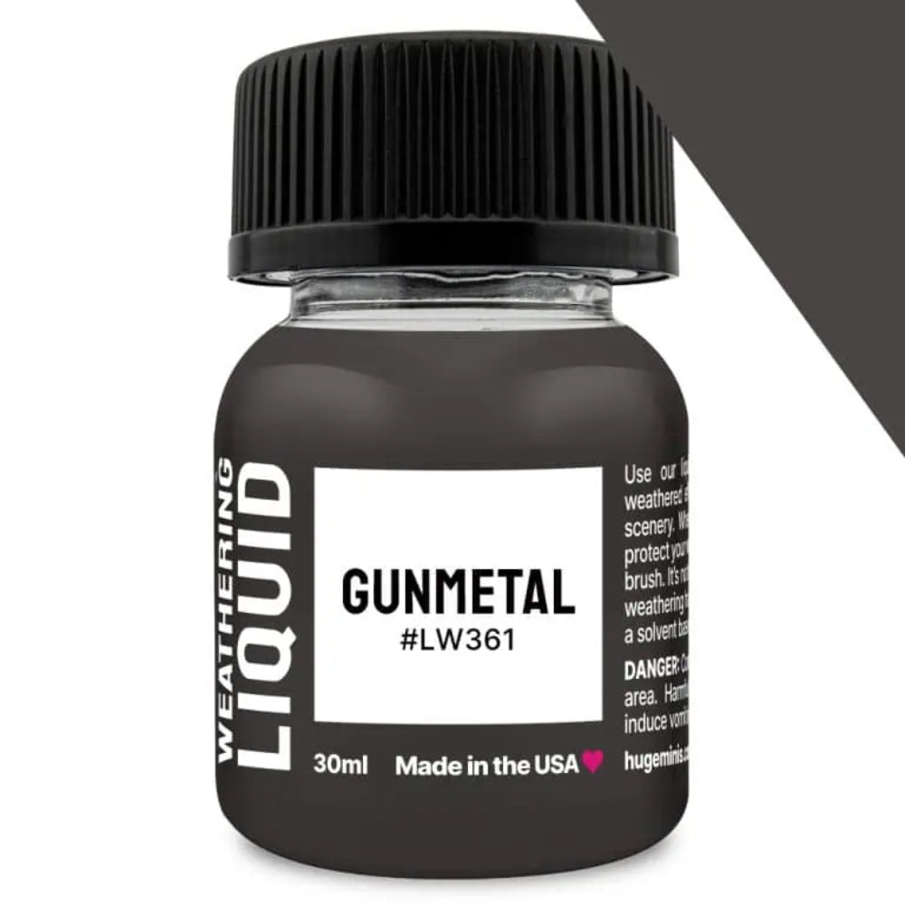 A 30ml bottle of gunmetal weathering liquid with a black ribbed cap and clear glass containing dark gray liquid