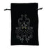 Black velvet kraken dice bag with embroidered white octopus and yellow eyes featuring drawstring closure