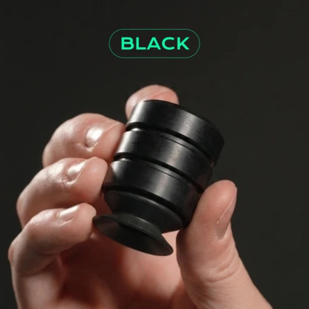 Black cylindrical fidget spinner p’kup card lifter with smooth matte finish and concentric rings design