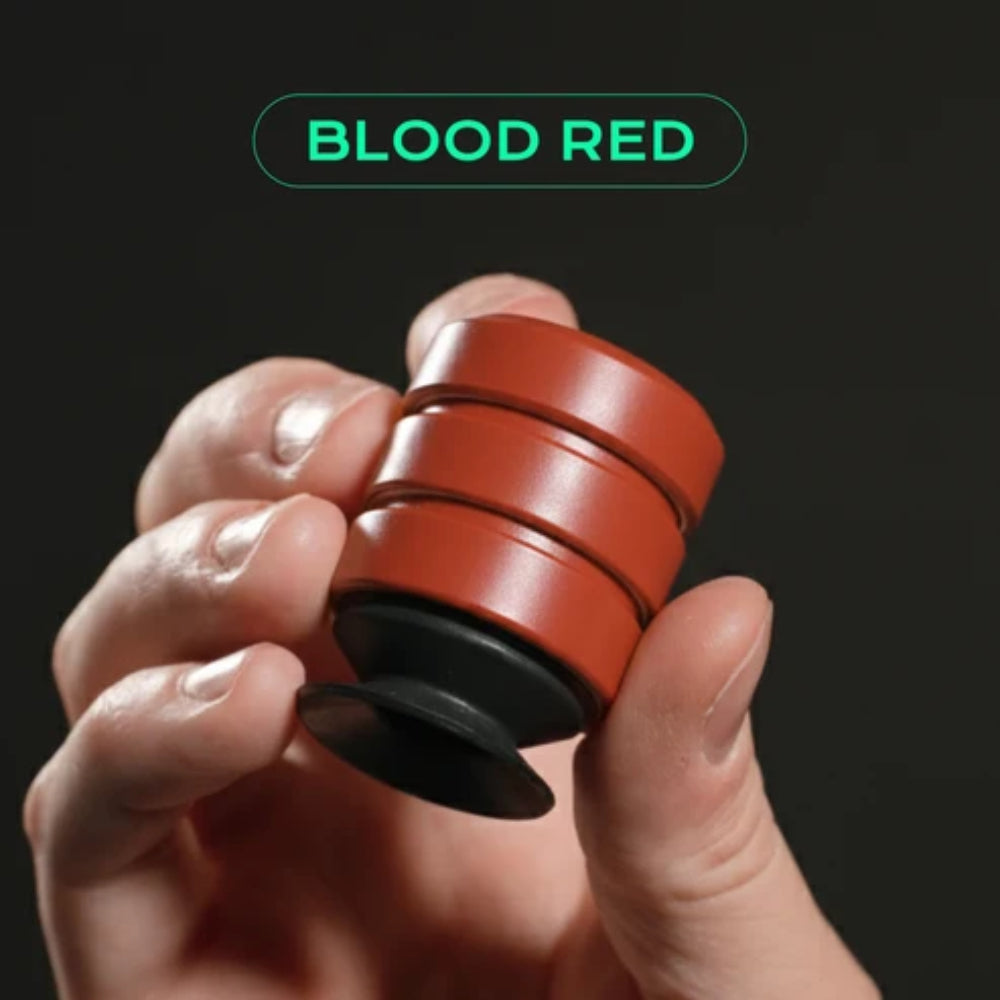 Blood red p’kup card lifter fidget spinner with three stacked circular sections and black base for easy card handling