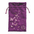 Purple velvet drawstring pouch decorated with silver-embroidered butterflies and geometric d20 die symbol for dice storage