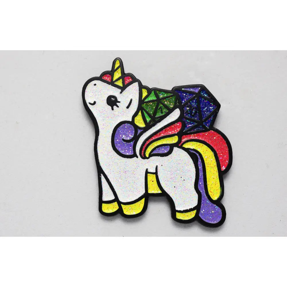 Sparkles pony pin is a glittery white unicorn pin with a rainbow mane and colorful geometric shapes on its back