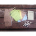 A rustic burlap drawstring bag holding game components for the quiet year rpg board game