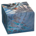 Blue leather-like card storage box by ultimate guard featuring dynamic fantasy illustration with characters in motion