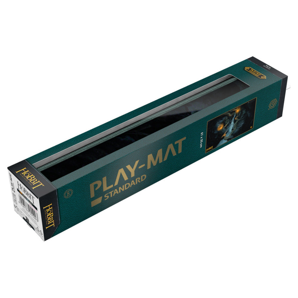 Dark green cardboard box with gold lettering and clear window showcasing the hobbit playmat by Ultimate Guard