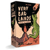The very bad lands t-rex board game box shows a cartoon green t-rex on reddish terrain with volcanoes and an asteroid