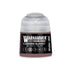 A small cylindrical bottle of warhammer tone pro paint in the shade carmine blades 12ml shown from the back side