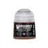 A small cylindrical bottle of Warhammer Tone Pro Carthalos Skin paint with a clear cap and black label with white text