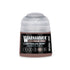 A small cylindrical bottle of Warhammer Tone Pro Carthalos Skin paint with a clear cap and black label with white text