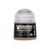 A small translucent plastic bottle of warhammer tone pro carthalos skin paint with a clear cap and black label