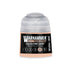 A Warhammer tone pro paint bottle in celestine skin shade with a translucent cap and black label in 12ml size