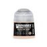 A small translucent plastic bottle of Warhammer Tone Pro Celestine Skin paint with beige liquid and clear cap