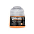 A small cylindrical bottle of warhammer tone pro paint in chotec orange with a clear plastic cap and orange label