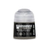 A small cylindrical bottle of warhammer tone pro paint in dataslate grey for miniature painting 12ml