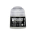 A small translucent plastic bottle of Warhammer Tone Pro paint in dataslate grey color 12ml capacity