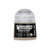 A small translucent plastic bottle of Warhammer Tone Pro Gnarlwood paint with black label and white text 12ml