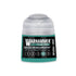 A small translucent plastic bottle of Warhammer Tone Pro paint in green Morkshroom with a teal label and black text
