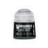 A small cylindrical bottle of Warhammer Tone Pro paint in Kasrkin Green with a clear cap and black label with white text