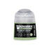 A small translucent plastic bottle of Warhammer Tone Pro paint in Kasrkin Green 12ml for miniature painting