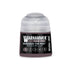 A small cylindrical bottle of Warhammer Tone Pro paint in the shade Magnus the Red for miniature detailing