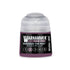 A small cylindrical bottle of Warhammer Tone Pro paint in the shade Magnus The Red 12ml for miniature painting