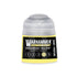 A vibrant yellow Warhammer Tone Pro Megaboss Yellow paint bottle with a clear cap and black label with white text