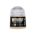 A small cylindrical bottle of Warhammer tone pro paint in necrolith bone color for miniature painting
