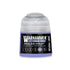 A small translucent plastic bottle of Warhammer Tone Pro paint in the shade Shalaxi Violet 12ml
