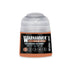 A small cylindrical bottle of Warhammer Tone Pro paint in the shade Taunar Ochre for miniature painting