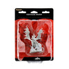 Wizkids unpainted nightmare dragon miniature in clear packaging with detailed white wings and textured scales