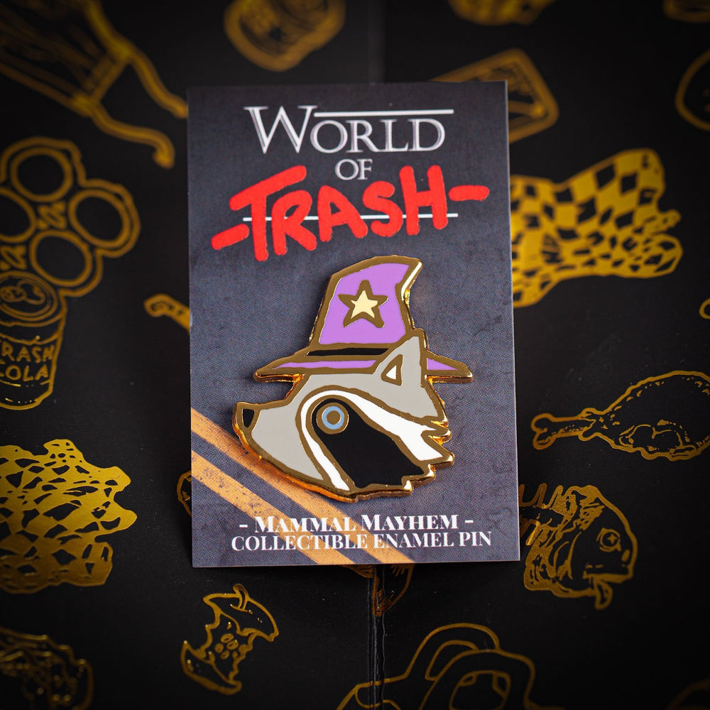 World of trash mammal mayhem hard enamel pin featuring a purple and gold raccoon wizard with a star hat