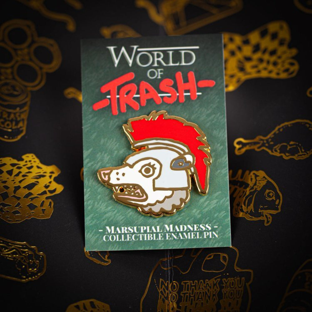 A red and white hard enamel pin featuring a marsupial with spiky hair on a World of Trash branded card